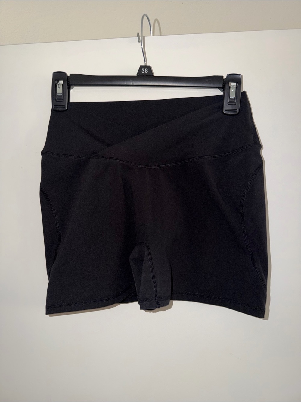 Alphalete womens shorts with front V-cross waist. Surface power short